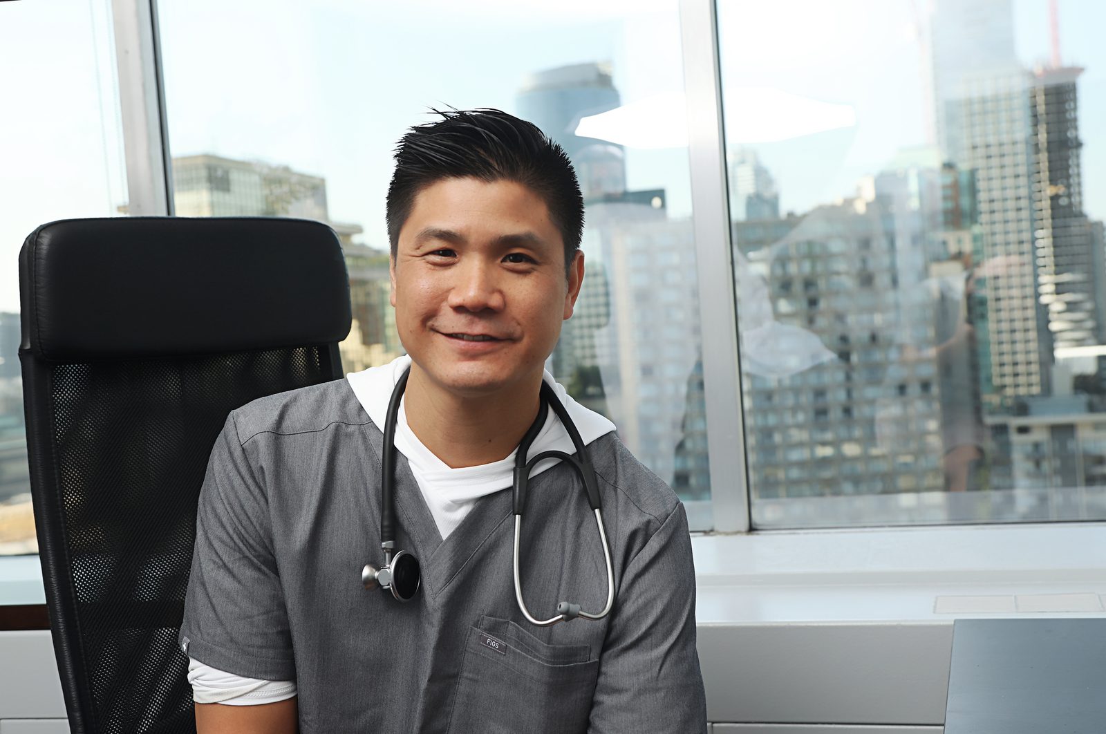 Dr. Marr seated wide, skyline